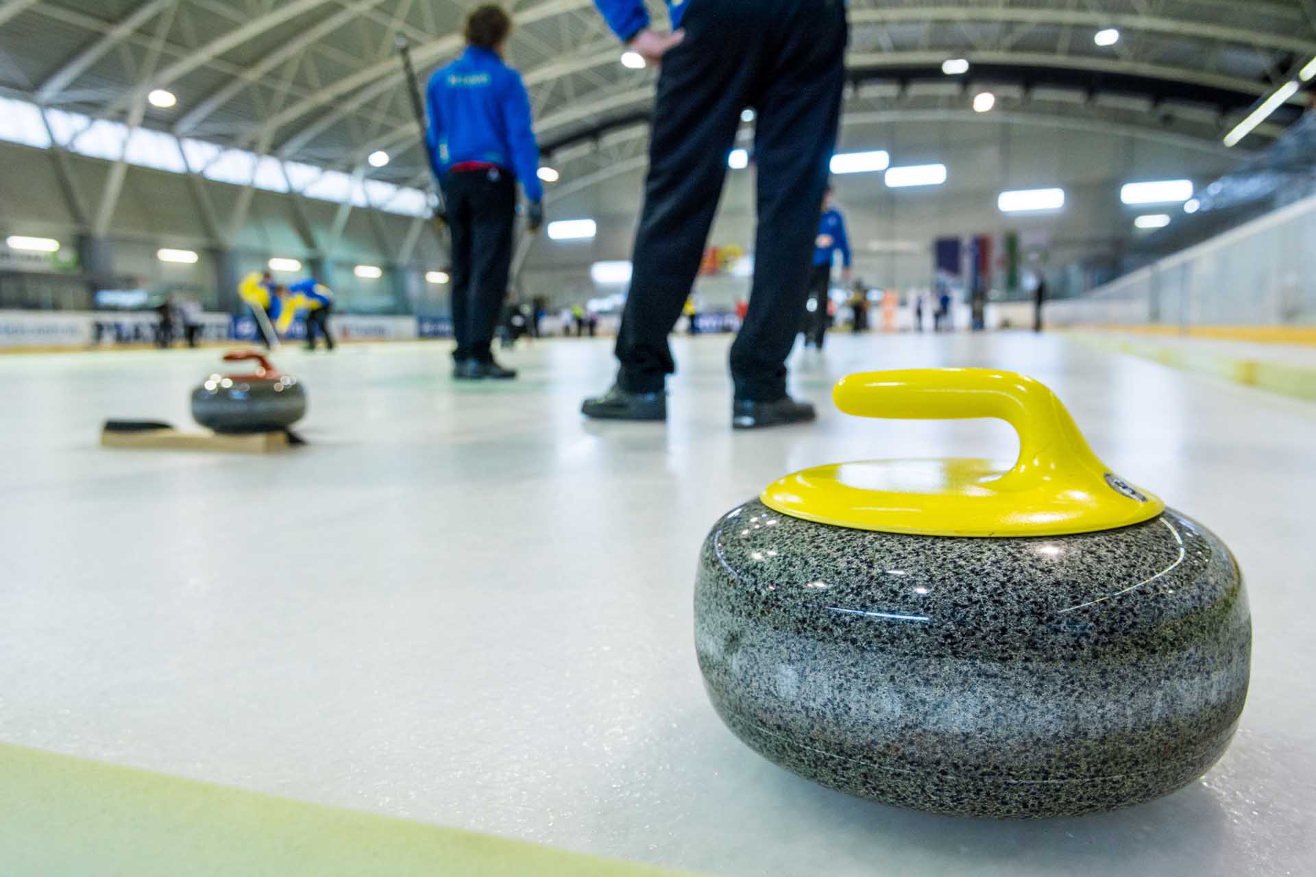 Curling stone on a game sheet